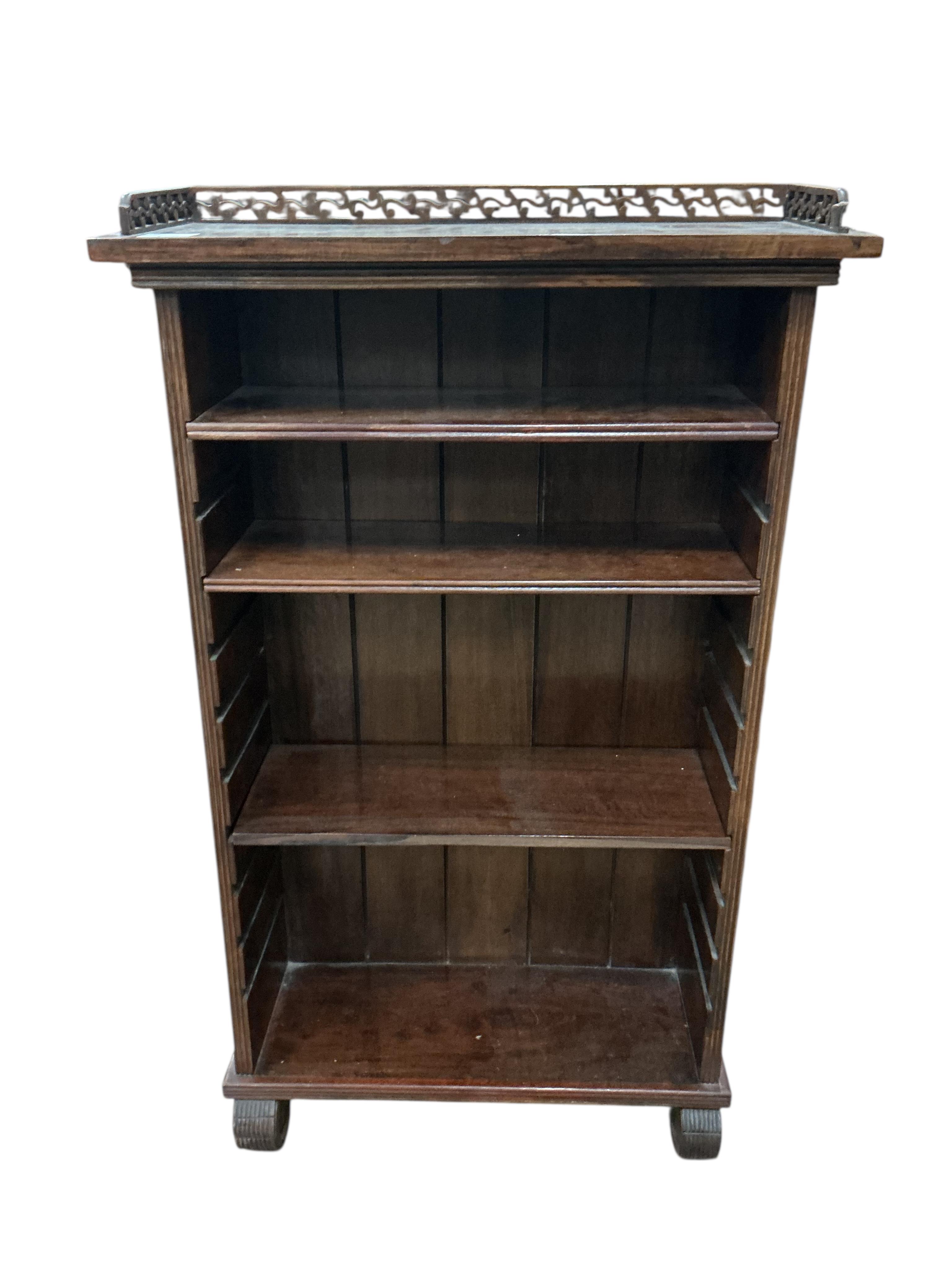 A small reproduction hardwood open bookcase, width 59cm, depth 22cm, height 100cm
